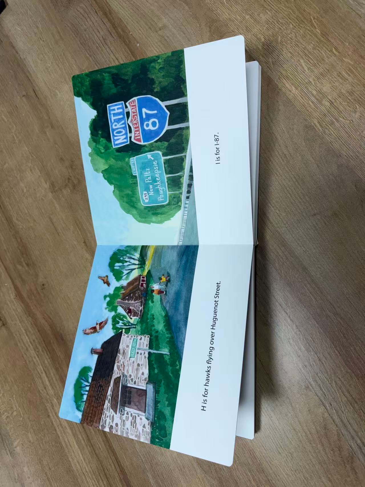 Full-color illustrated alphabet book spread