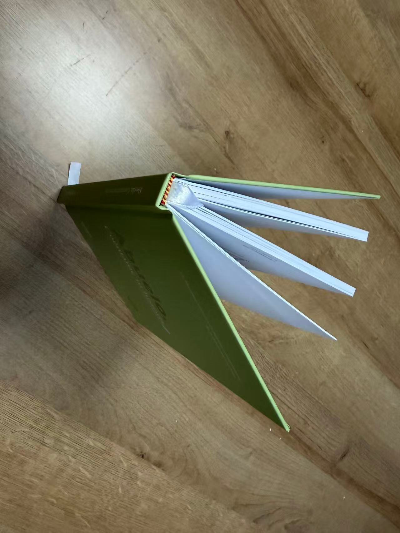 Green hardcover spine and binding detail