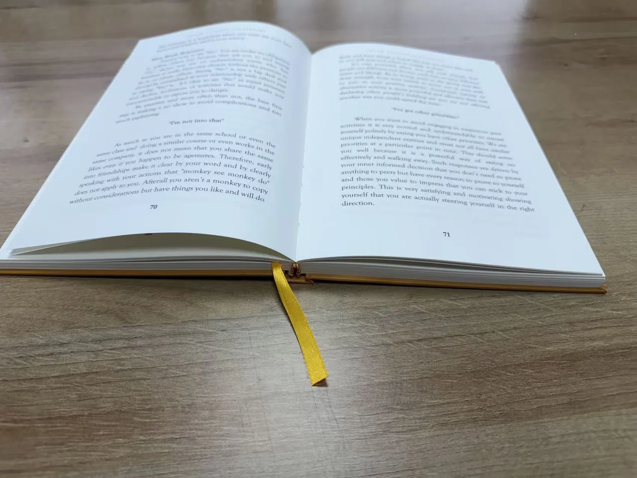 Open mentoring guide hardcover with printed text pages and ribbon marker
